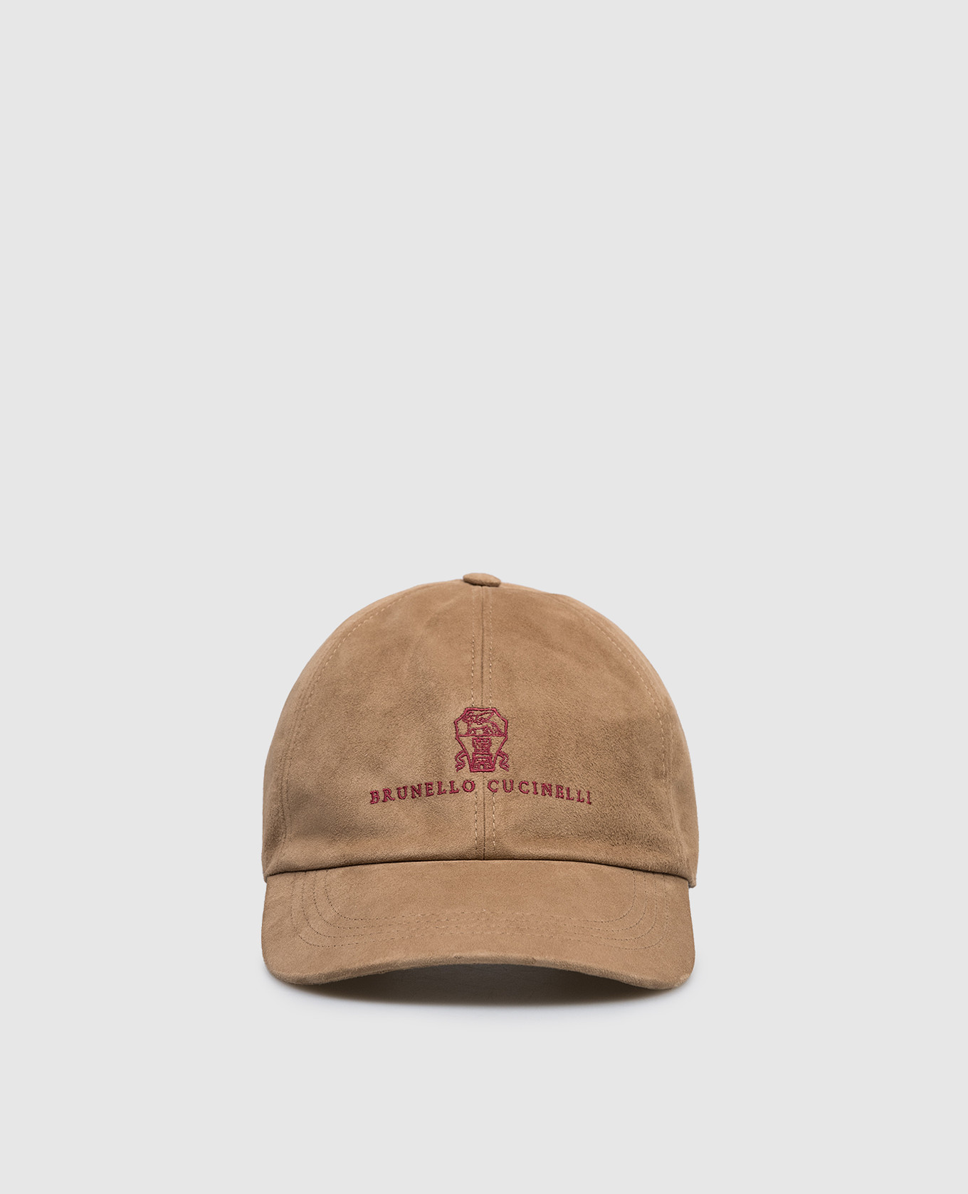 Brown suede cap with embroidered emblem