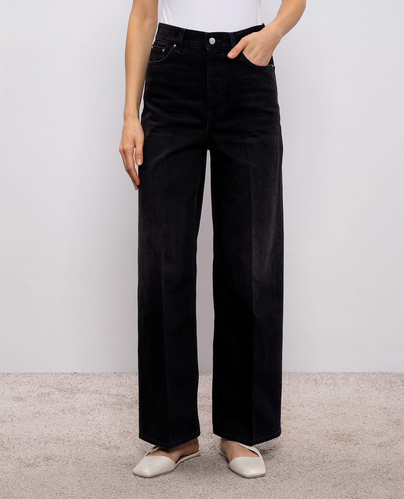 

Black jeans with a patch Toteme