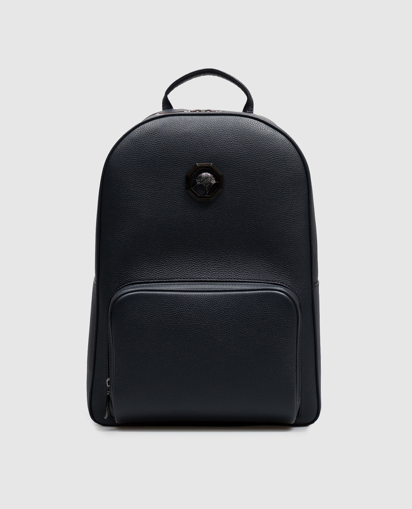 Blue leather backpack with textured emblem