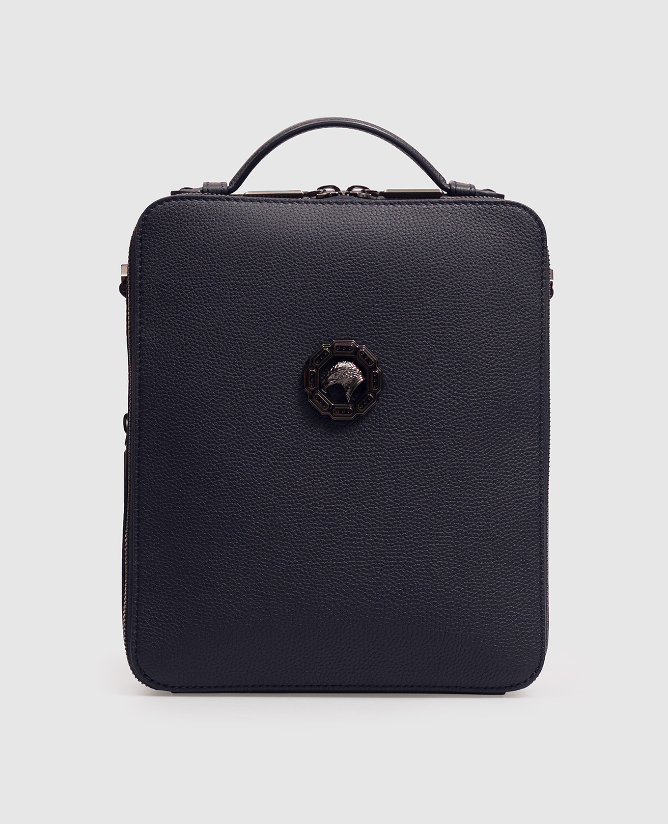 Blue leather bag with textured emblem