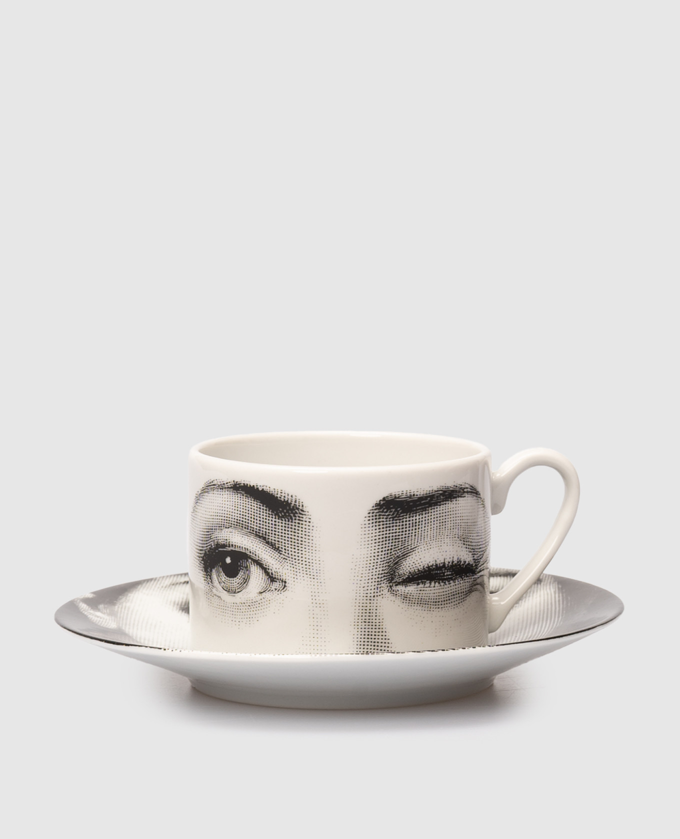 

White porcelain tea set Tema e Variazioni L'antipatico with cup and saucer Fornasetti