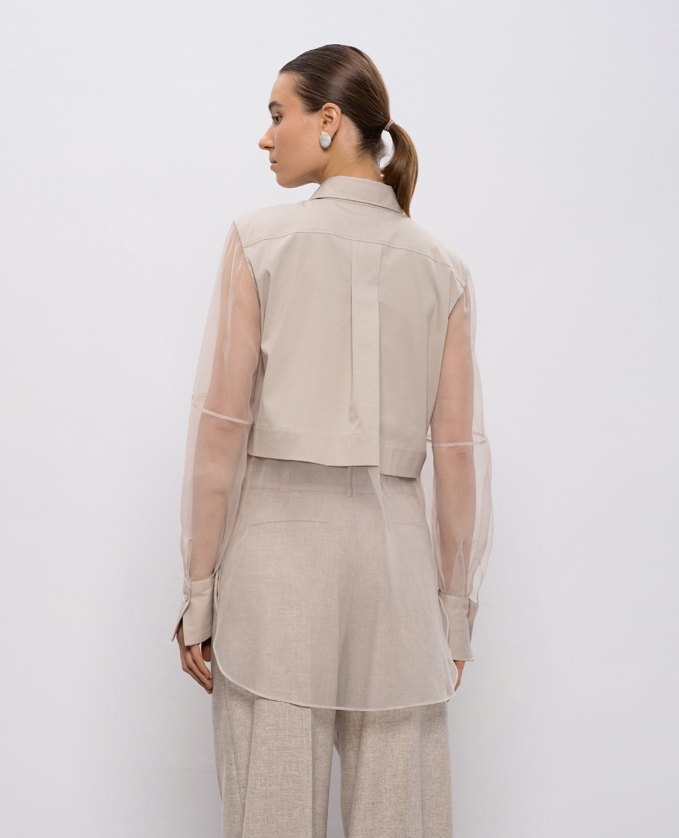 

Beige blouse with monil chain Brunello Cucinelli