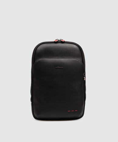 Black leather sling bag with metal logo