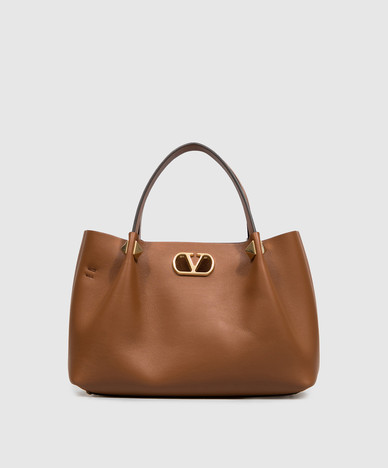 Brown leather tote bag with VLogo emblem