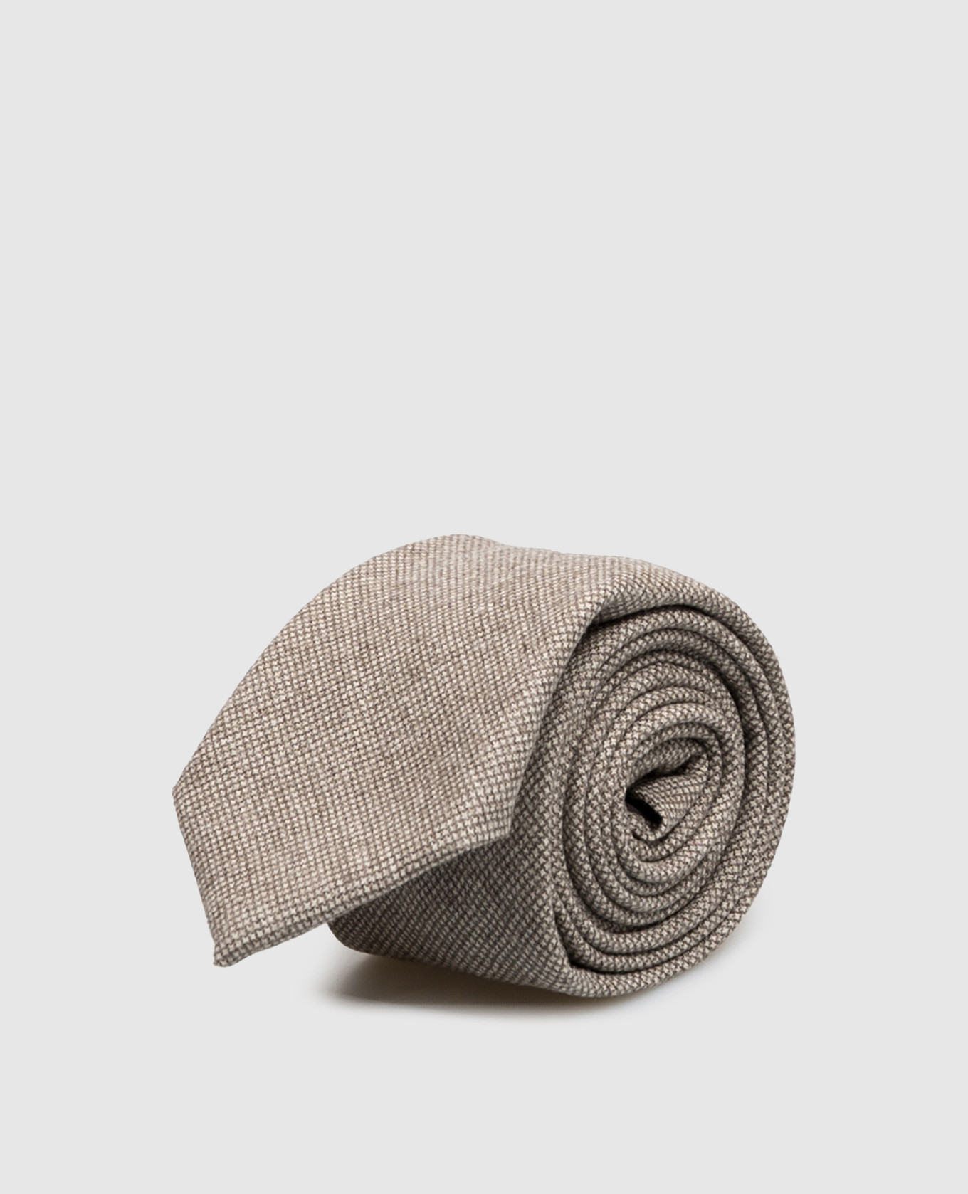 Beige wool tie with a pattern