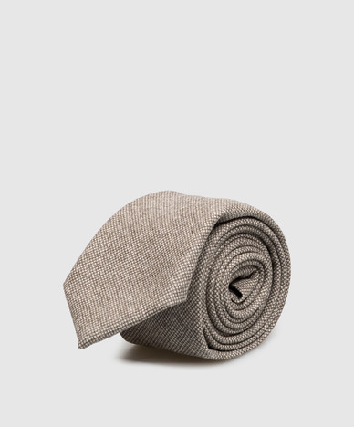 Beige wool tie with a pattern