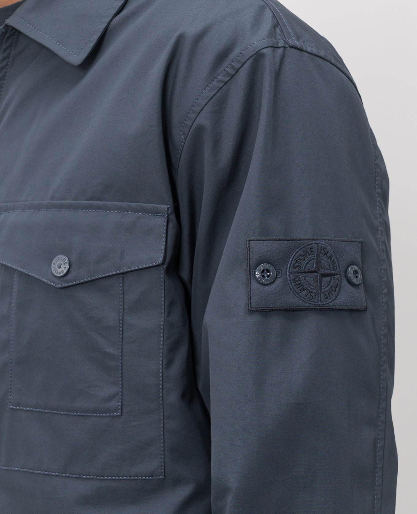 

Blue jacket with logo patch Stone Island