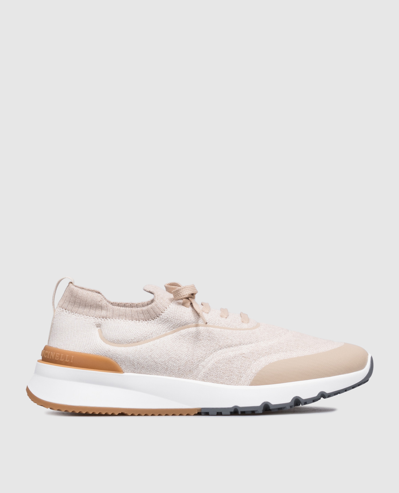 Beige sneakers with textured logo