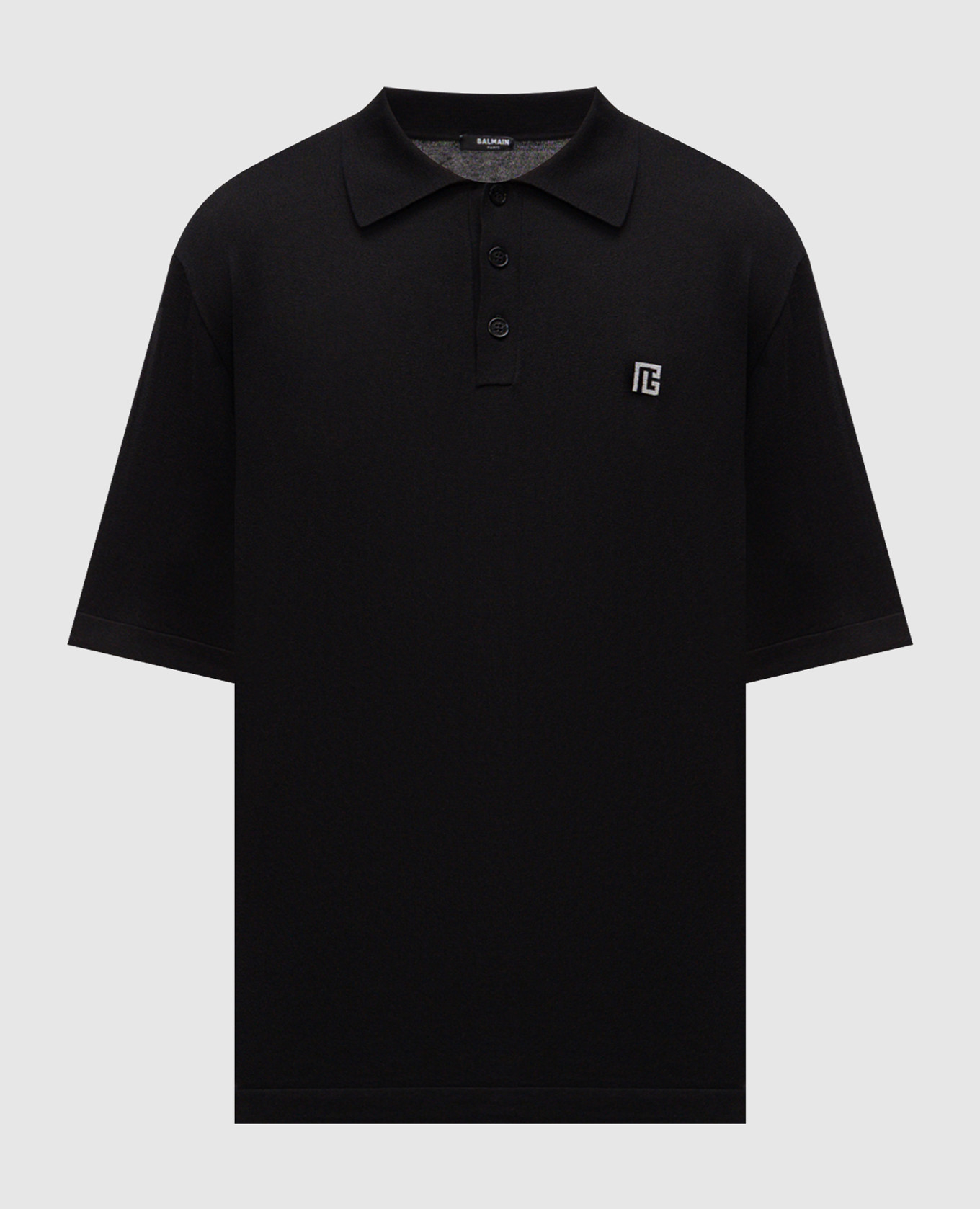 Black polo with emblem pattern