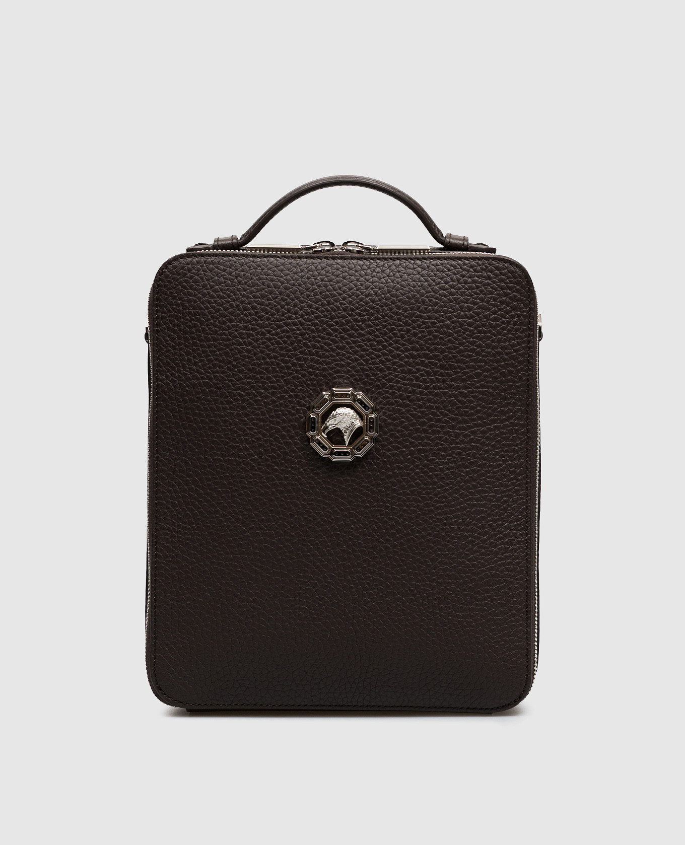 Brown leather bag with textured emblem