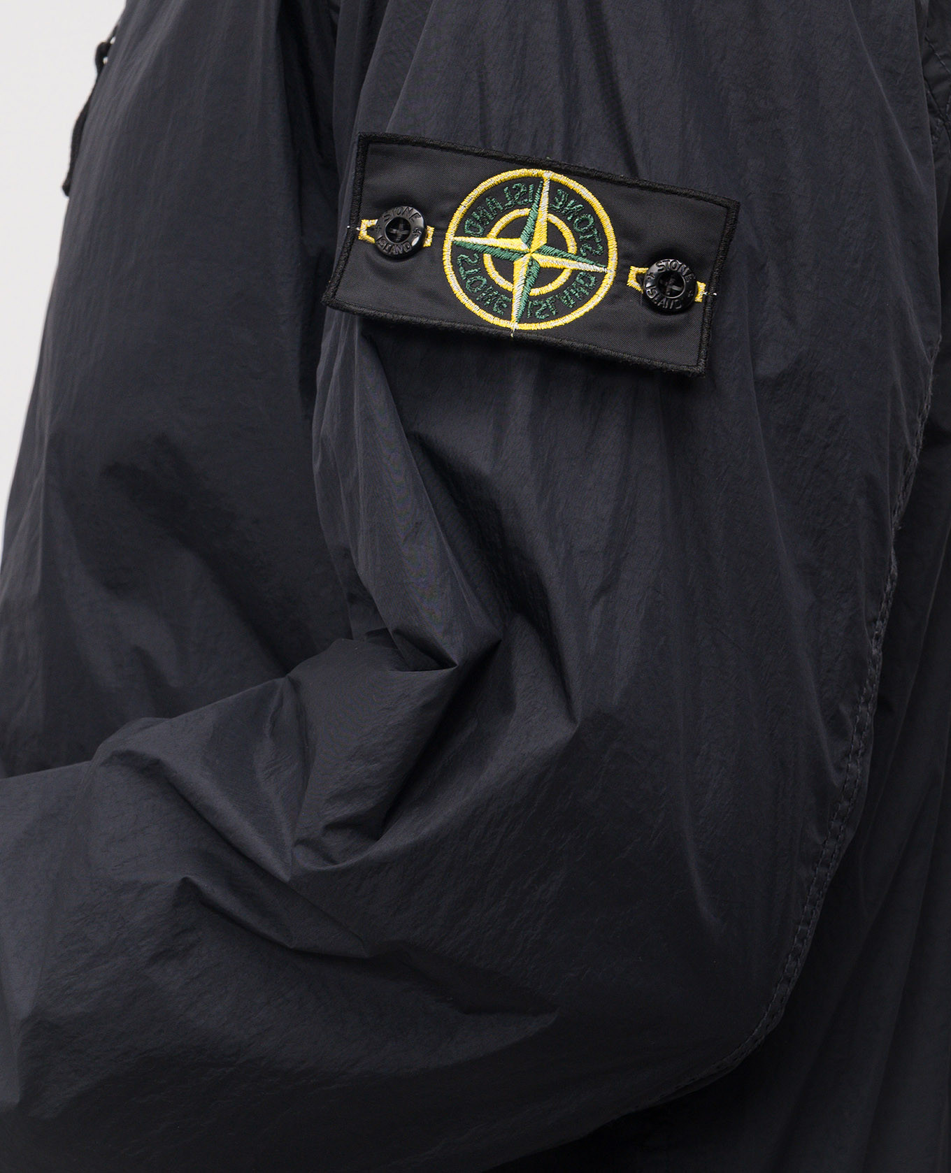 

Blue windbreaker with logo patch Stone Island