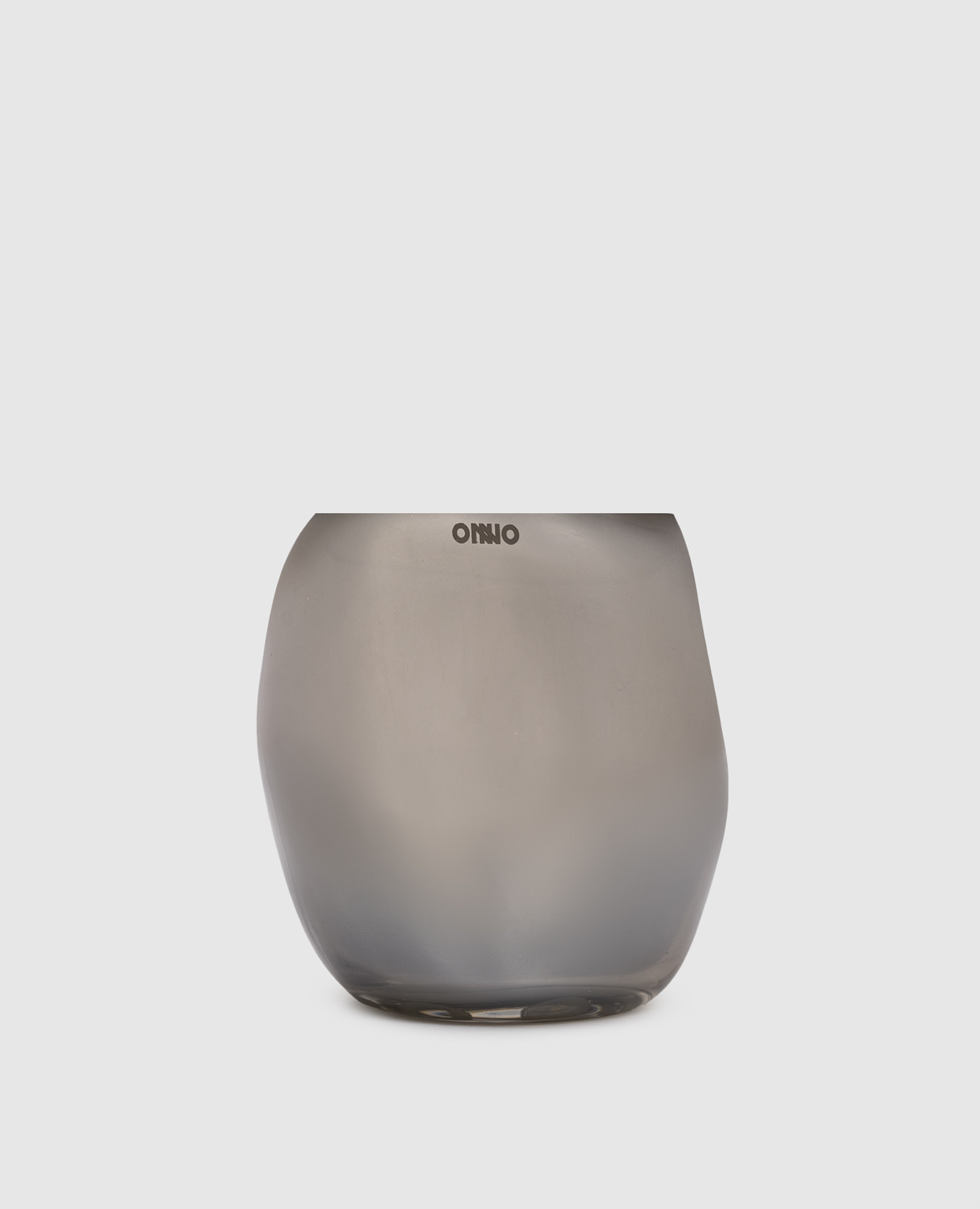 

Cape Smoked Grey  candle with Muse scent in a glass candle holder Onno, Silver