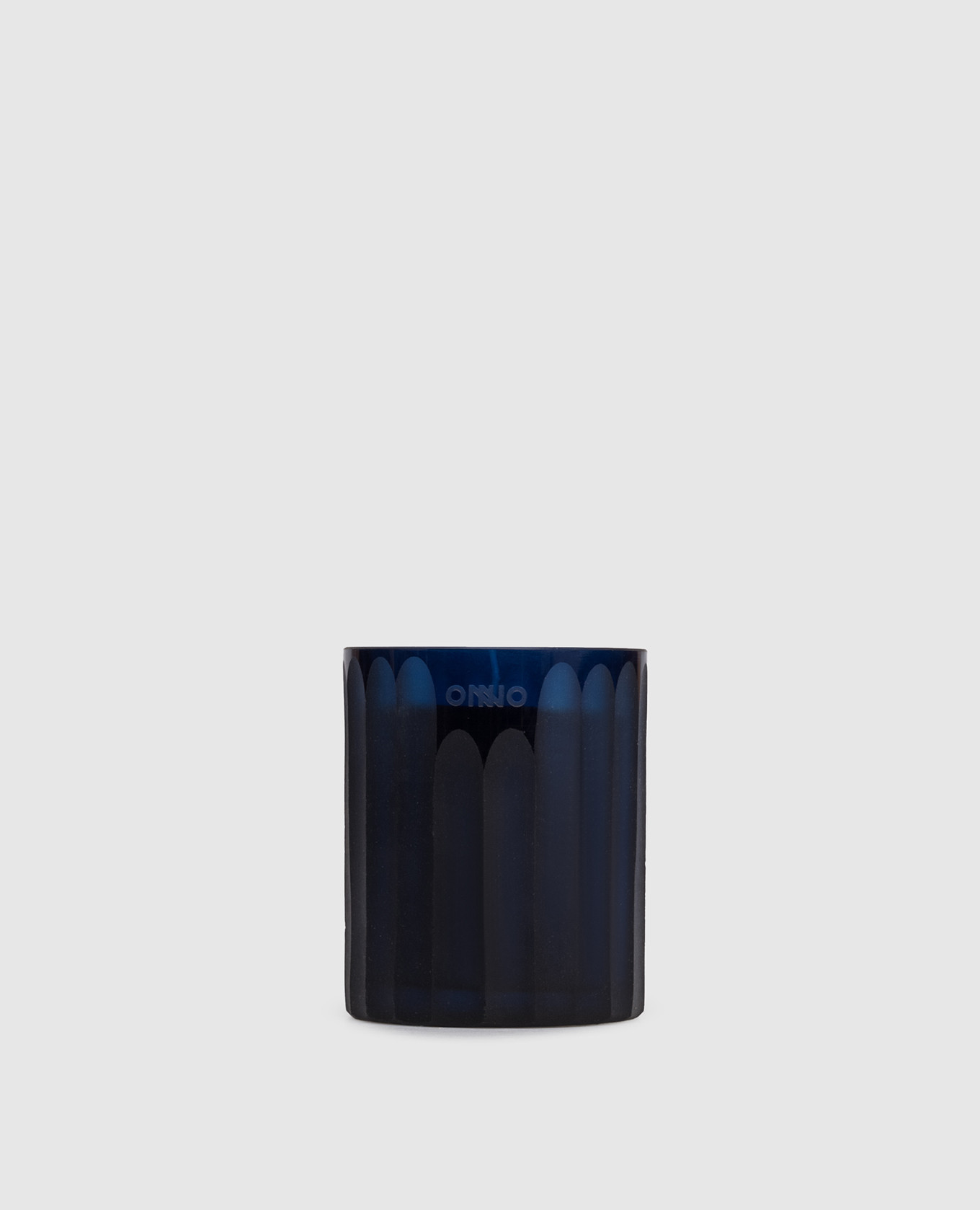 

Royal Blue XS candle with Ginger Fig scent in a glass candle holder Onno