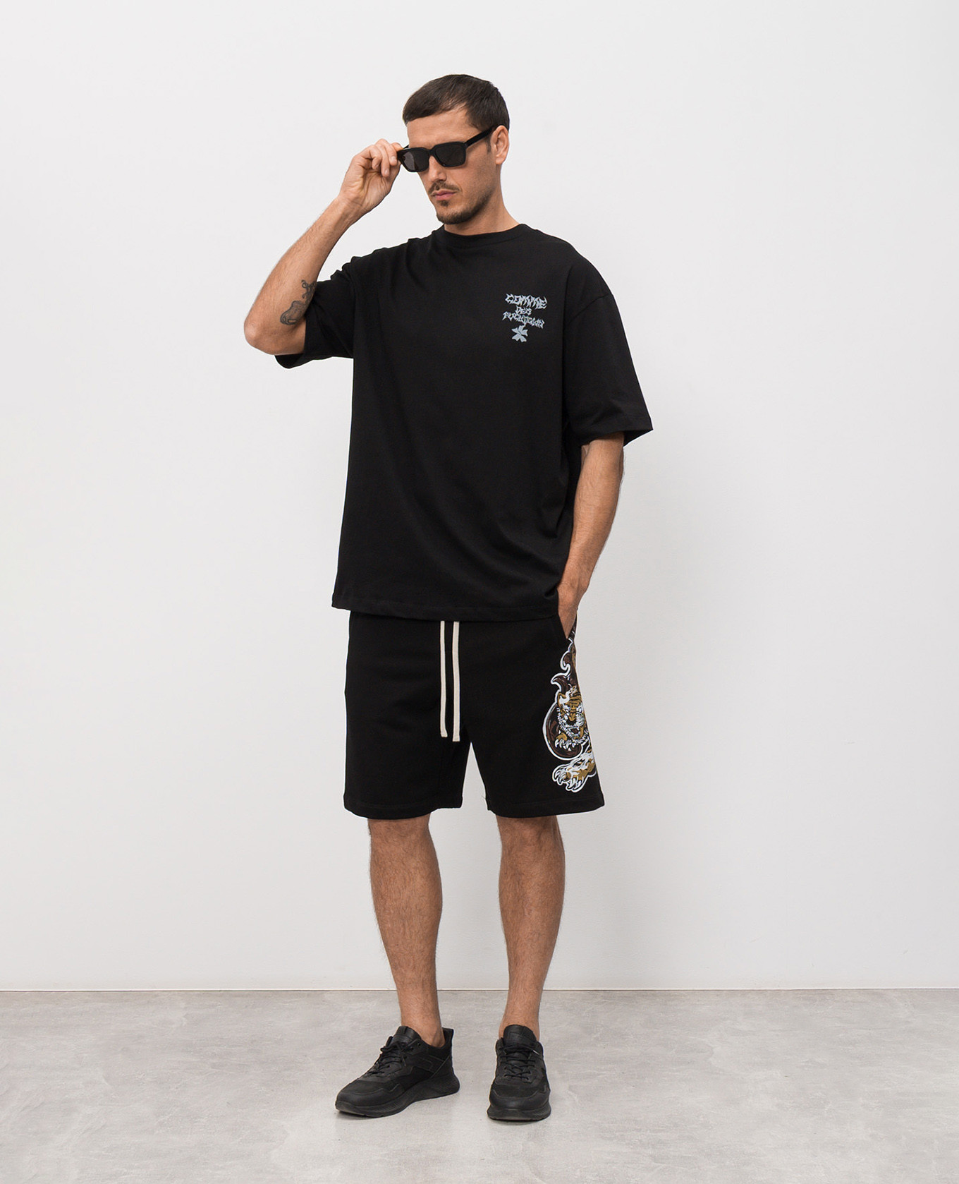 

Black T-shirt with branded print Comme des Fuckdown