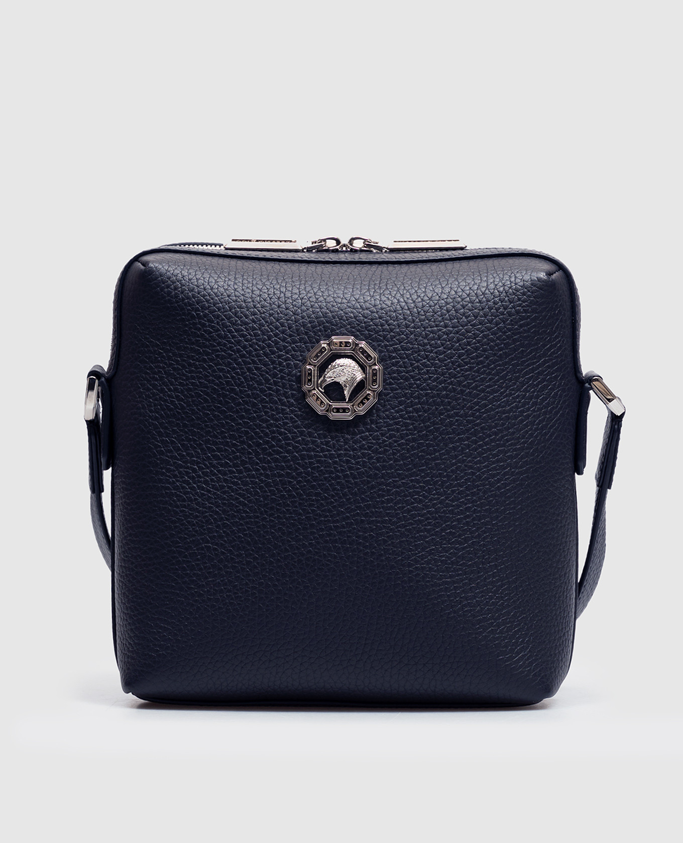 Blue leather bag with textured emblem