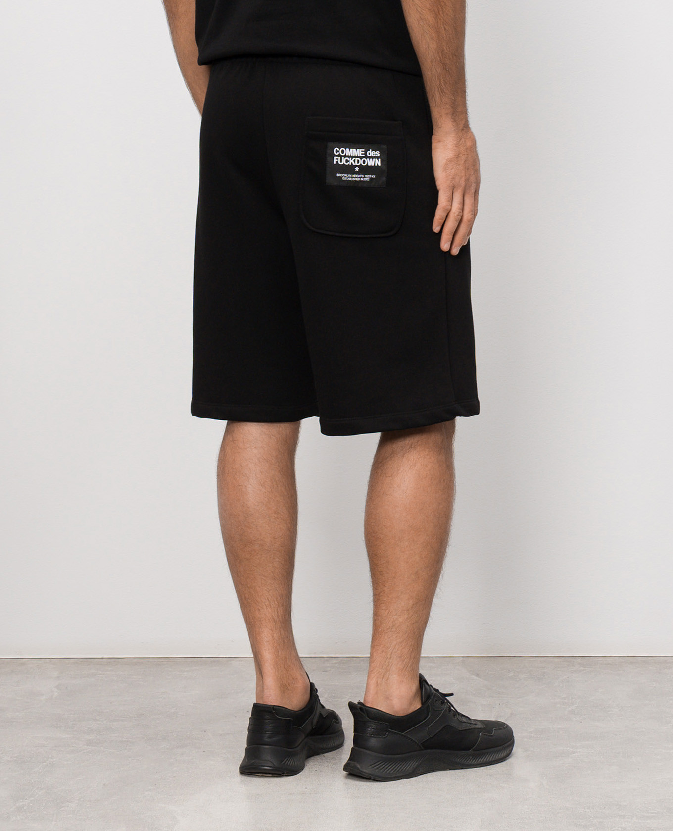 

Black shorts with logo print Comme des Fuckdown