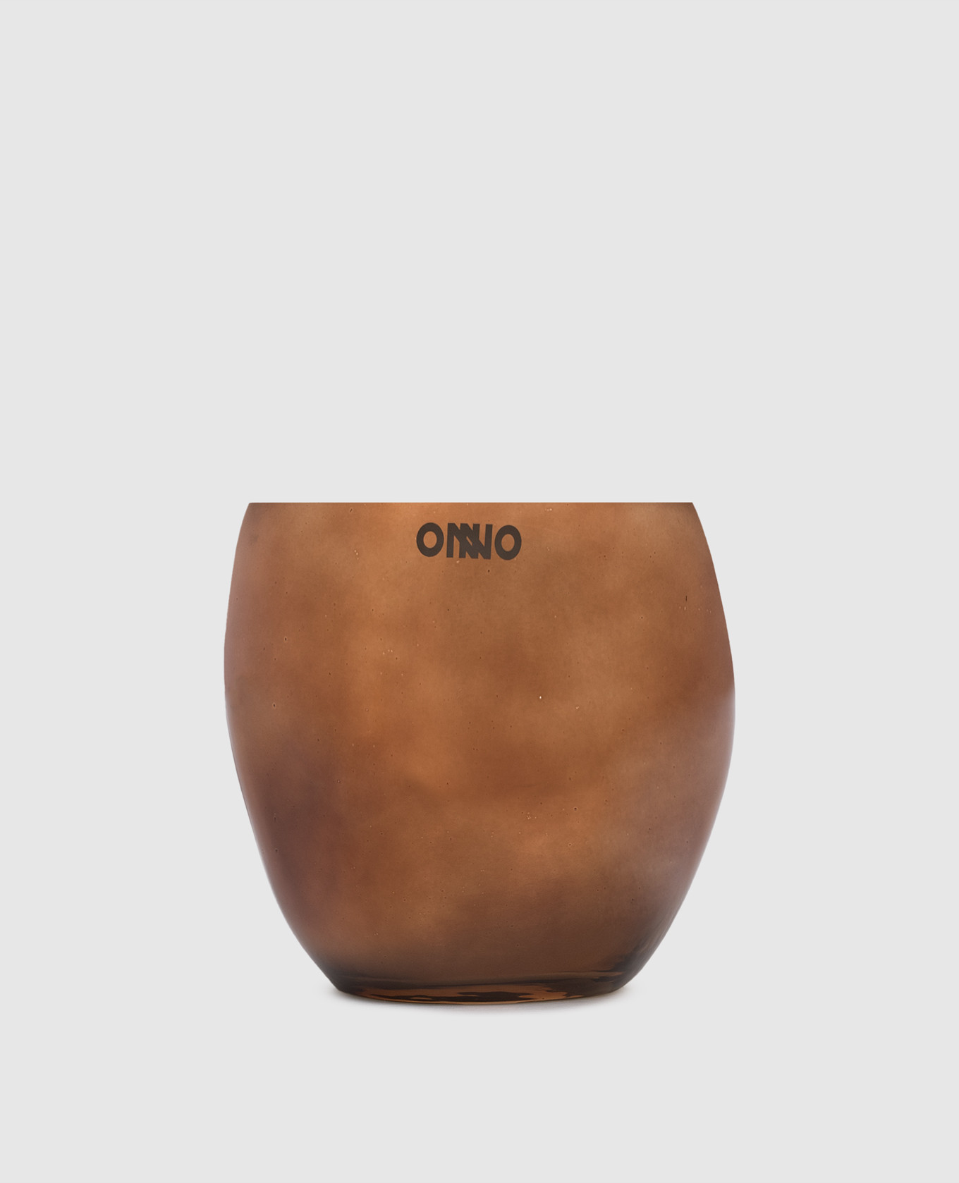 

Cape Copper  candle with Zanzibar scent in a glass candle holder Onno, Brown