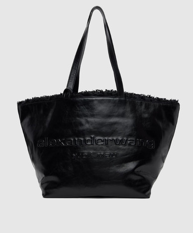 Black glossy leather tote bag with fur trim