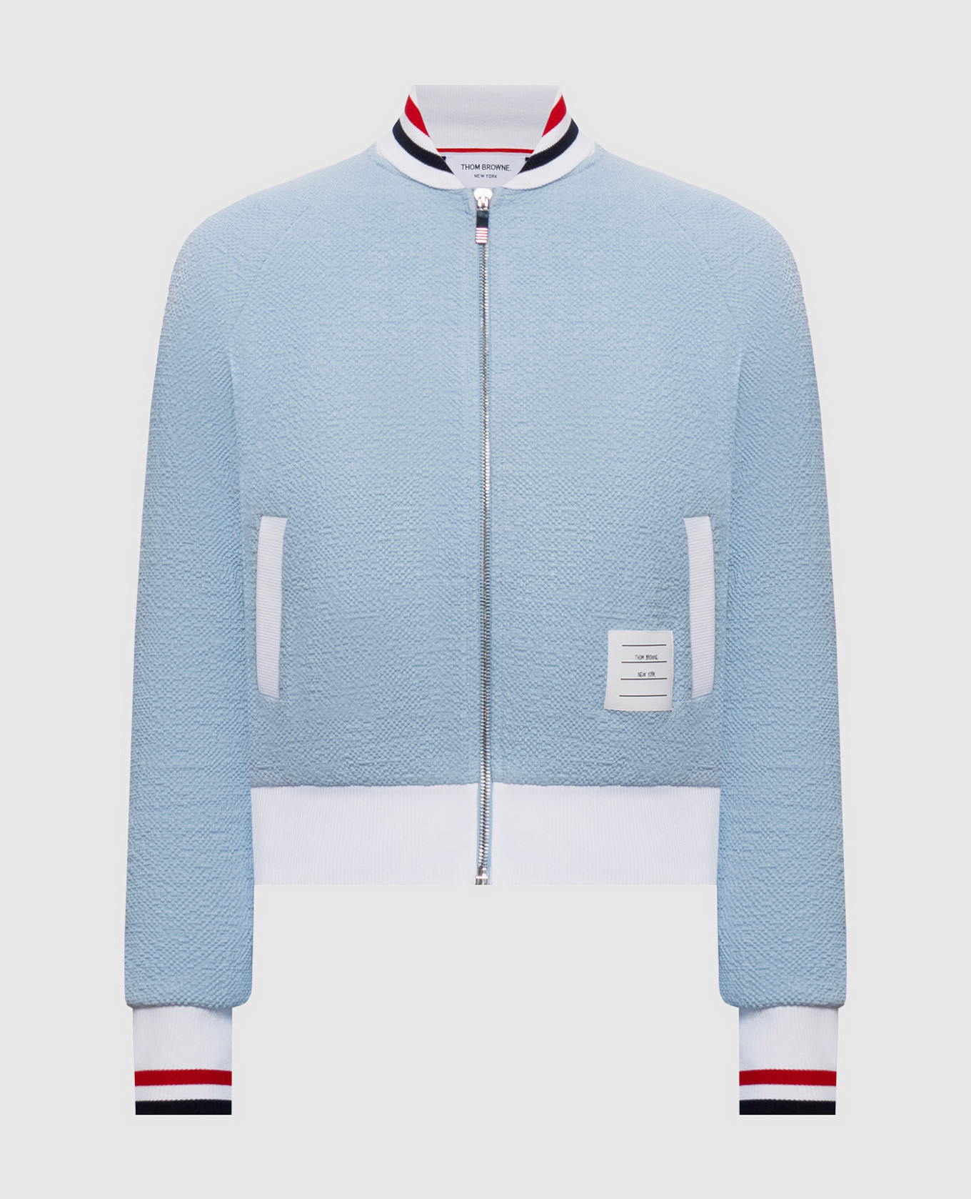 Blue sports jacket with logo patch