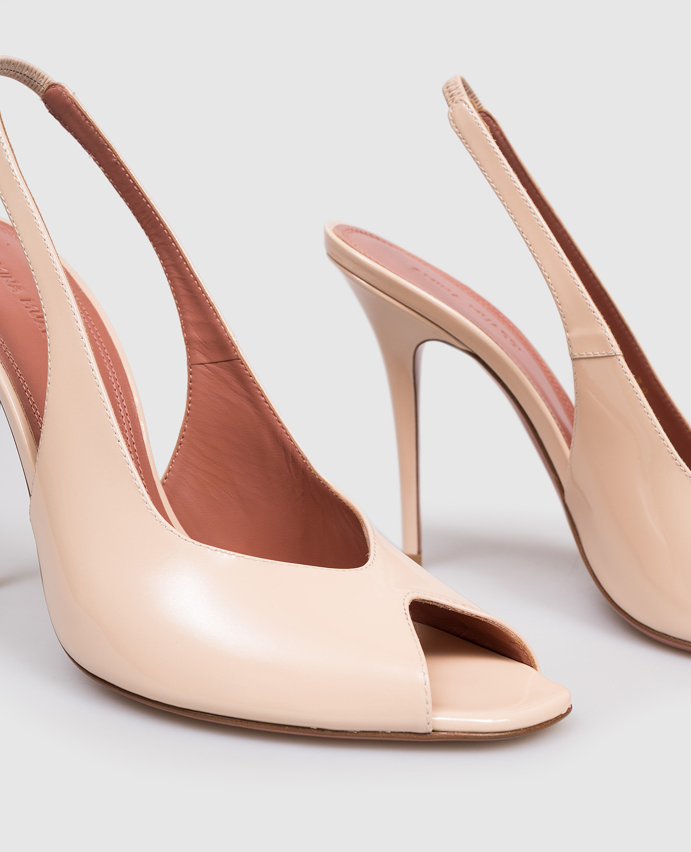 

Kristina beige patent leather slingbacks Amina Muaddi