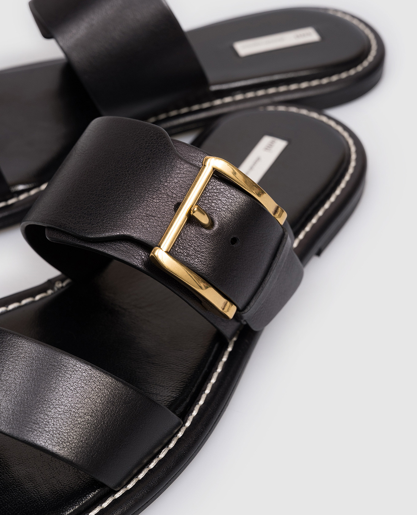 

Black leather flip-flops with logo engraving Ami Paris