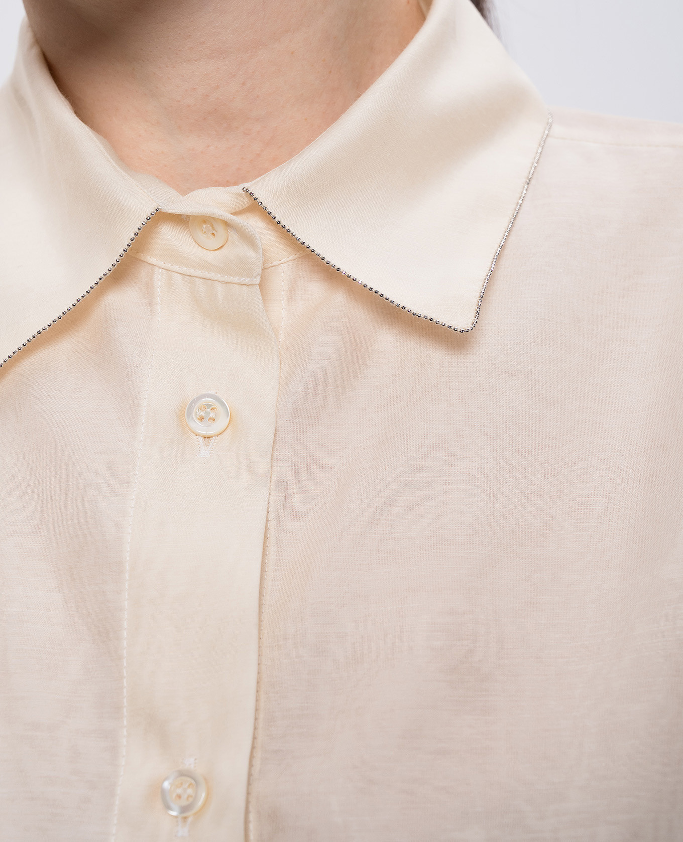

Beige silk blouse with monil chain Peserico