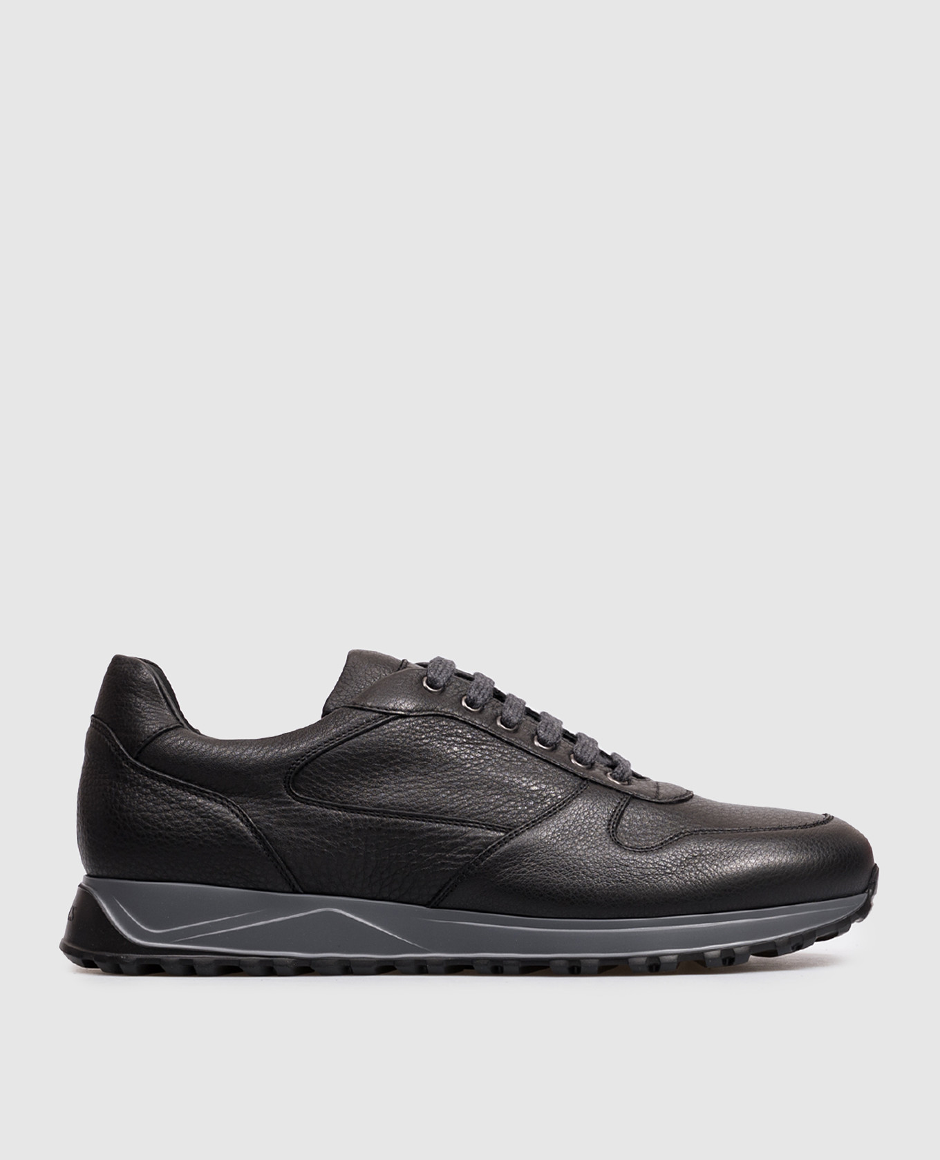 Black leather sneakers with embossed logo