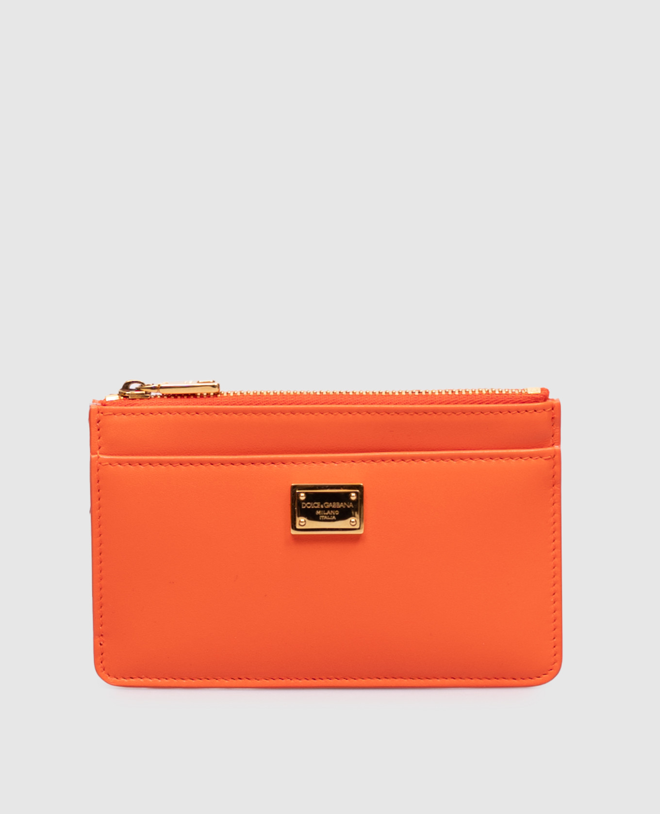 Orange leather cardholder with metal plate