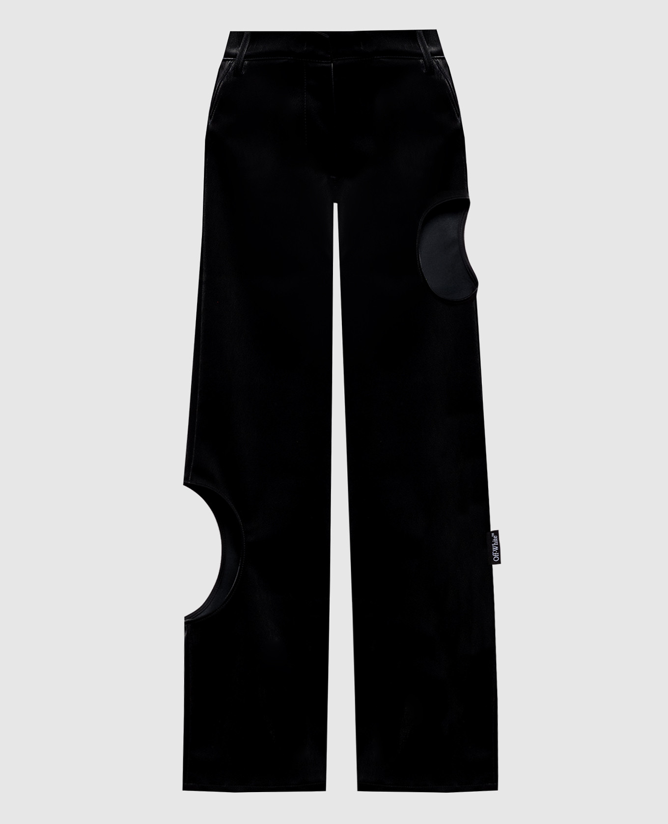 Zwarte broek met nauwsluitende uitsnijdingen.