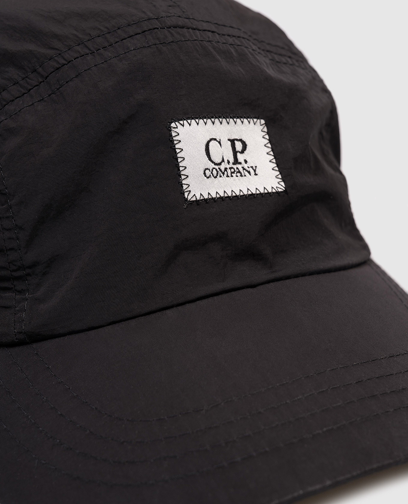 

Children's black cap with logo patch C.P. Company