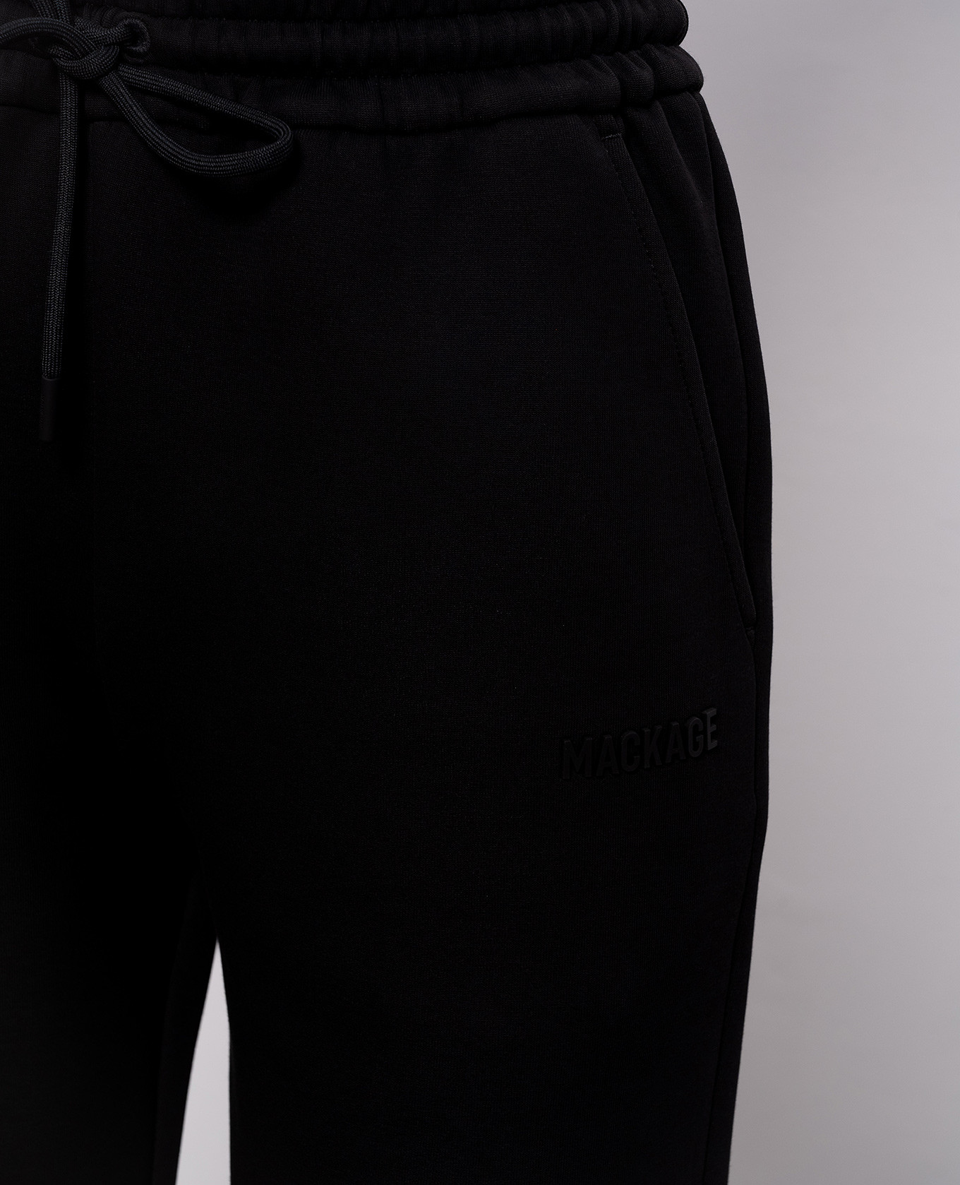

Nev black joggers with textured logo Mackage