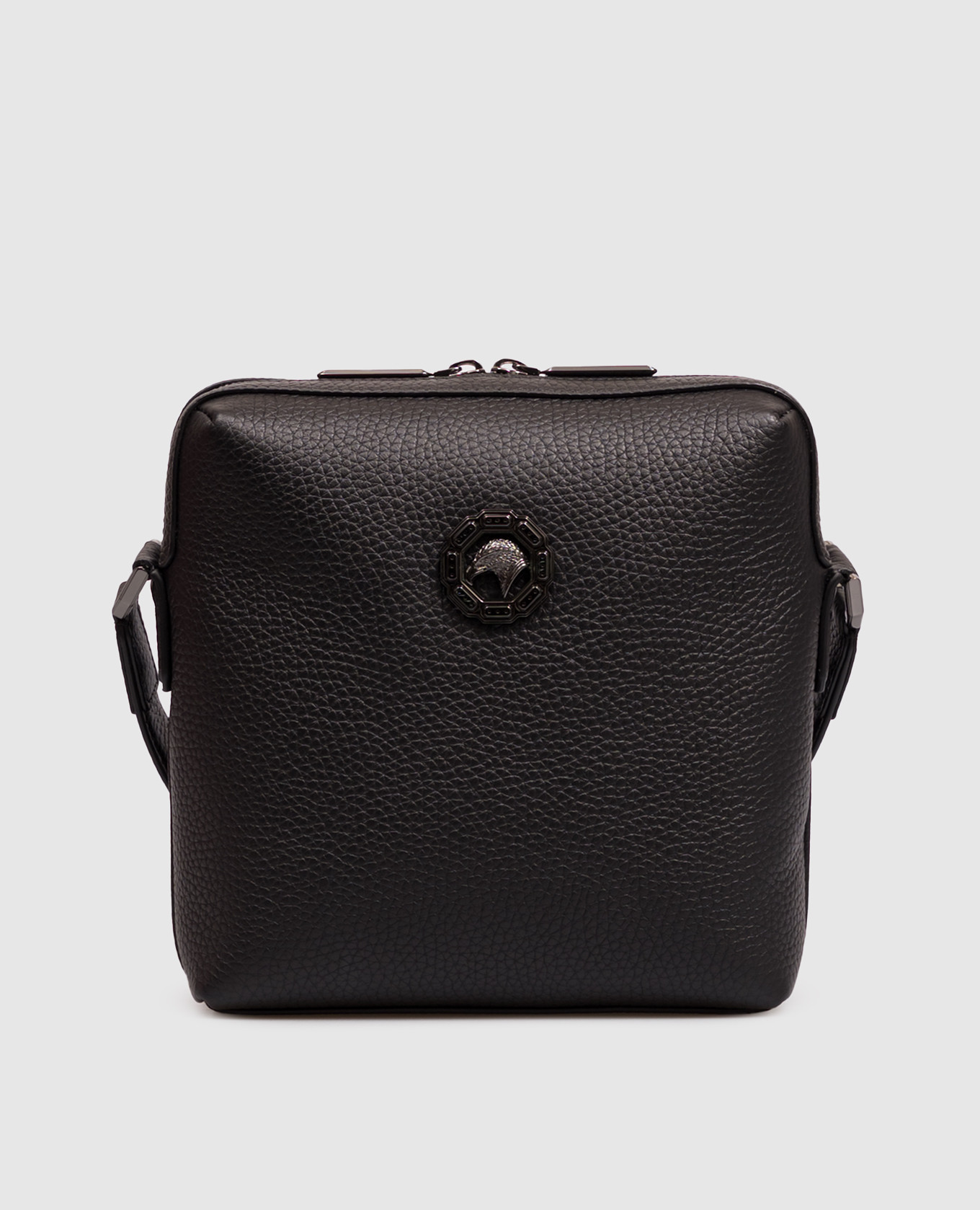 Black leather bag with textured emblem