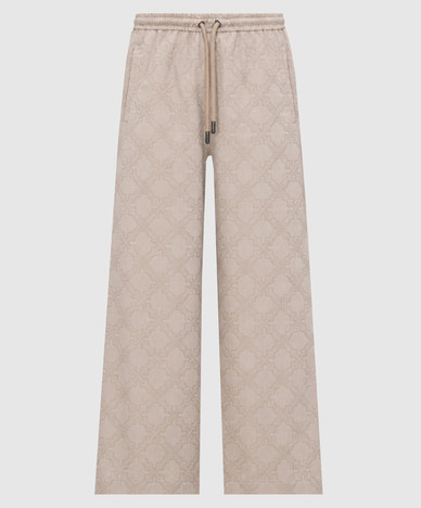 Beige pants with a logo pattern