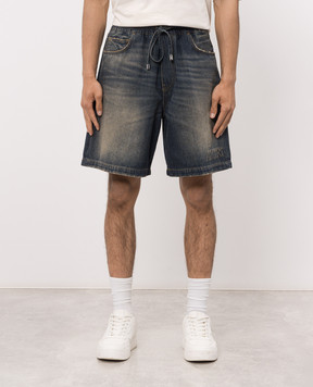 AMIRI Blue denim shorts with a distressed effect AM326SO001
