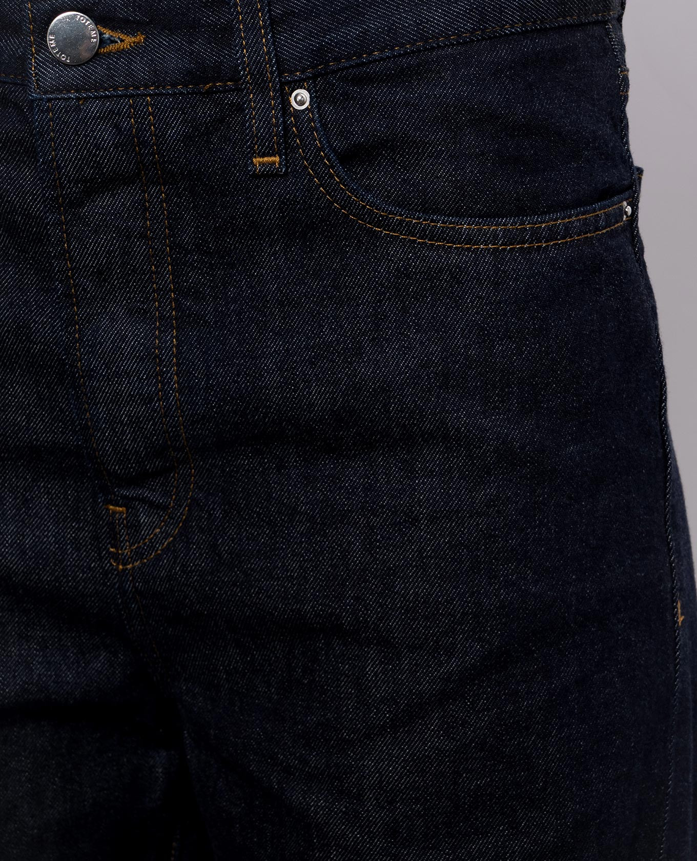 

Dark blue jeans with logo patch Toteme