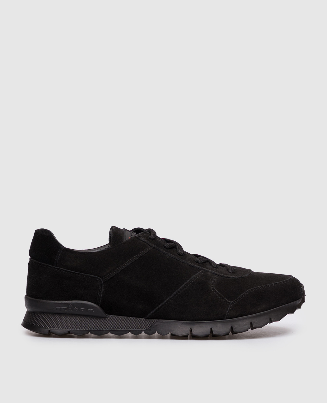 Black suede sneakers with textured logo