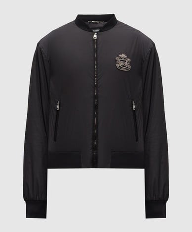 Black bomber jacket with heraldic logo patch