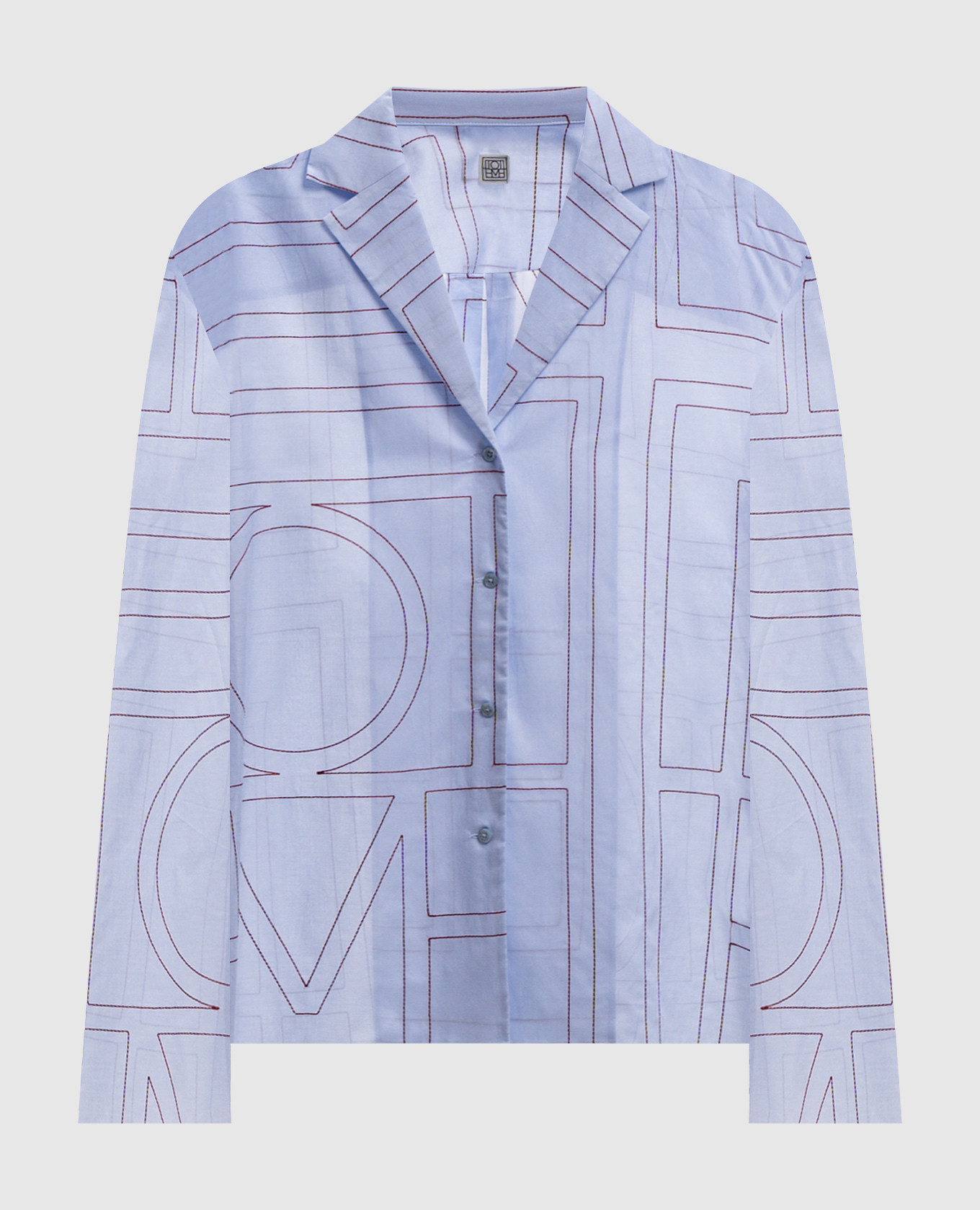 Blue shirt with contrasting monogram embroidery
