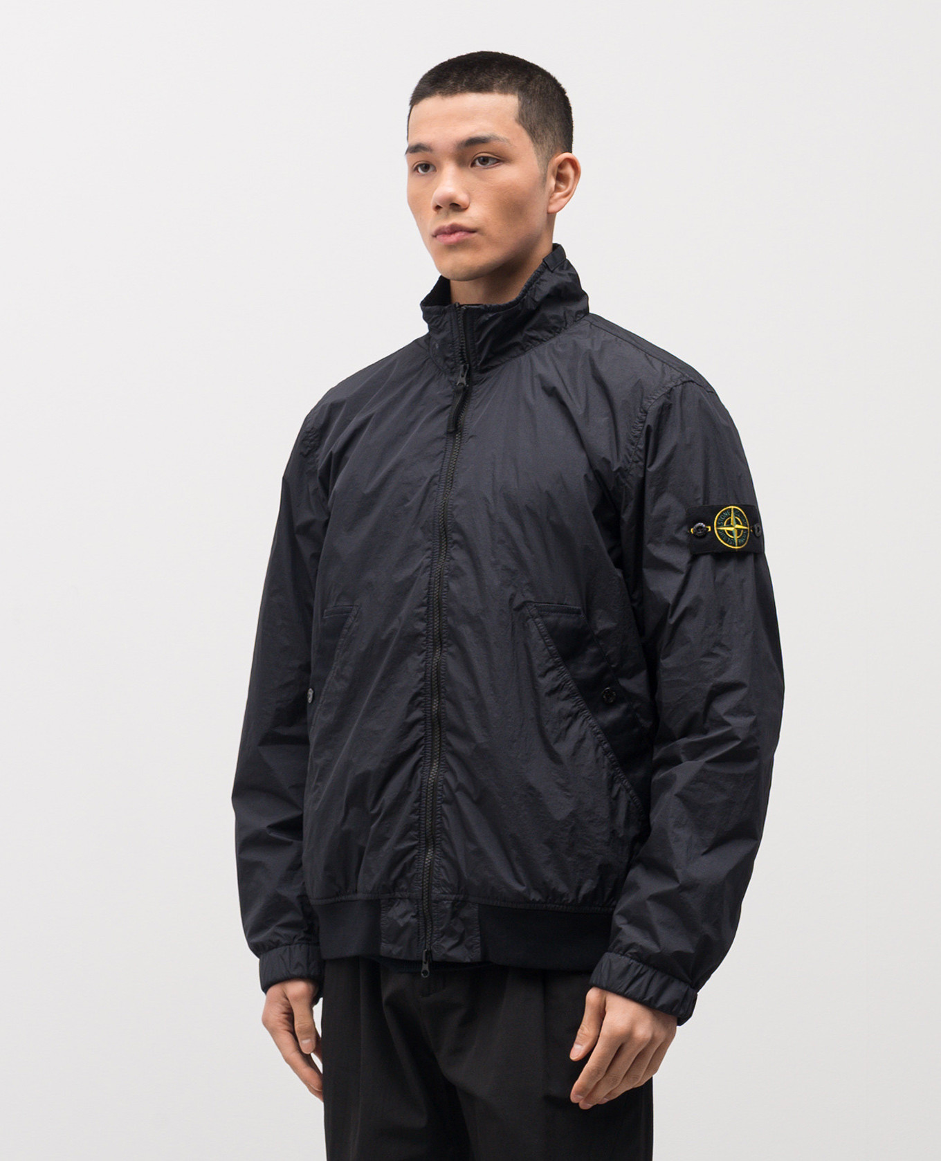 

Blue windbreaker with logo Stone Island