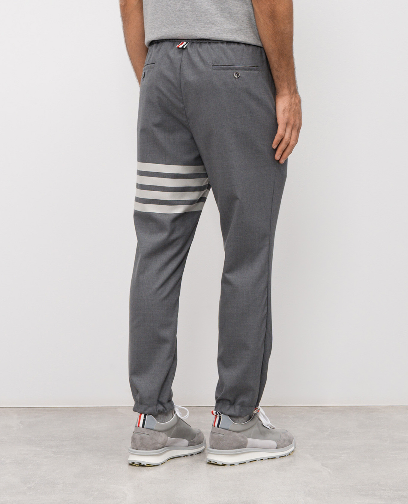 

Grey wool joggers with branded stripes Thom Browne