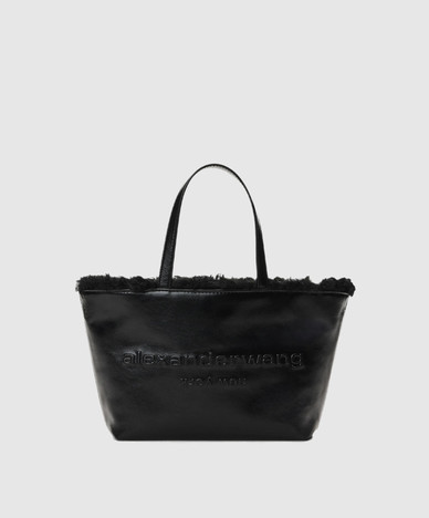 Black leather tote bag with fur trim
