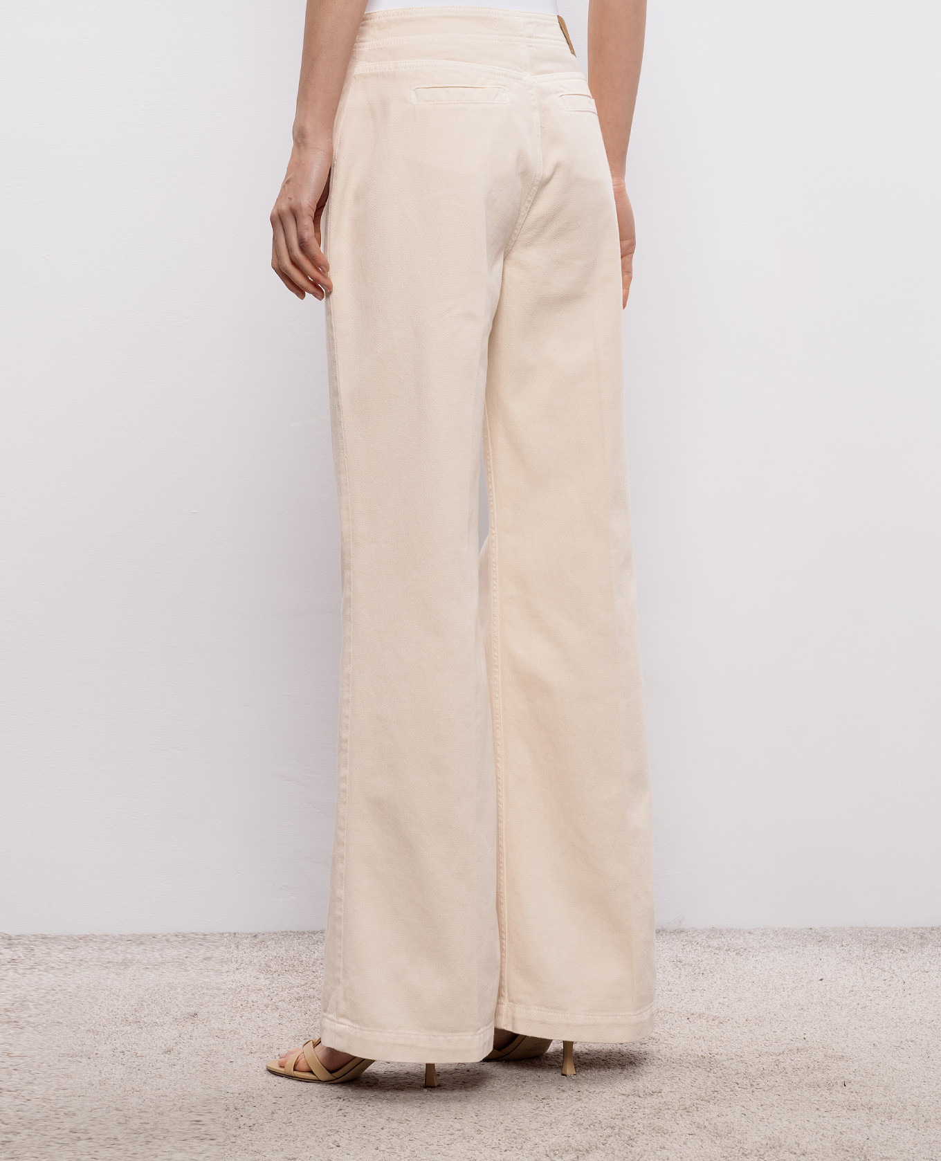 

Beige flared jeans with logo patch Twinset