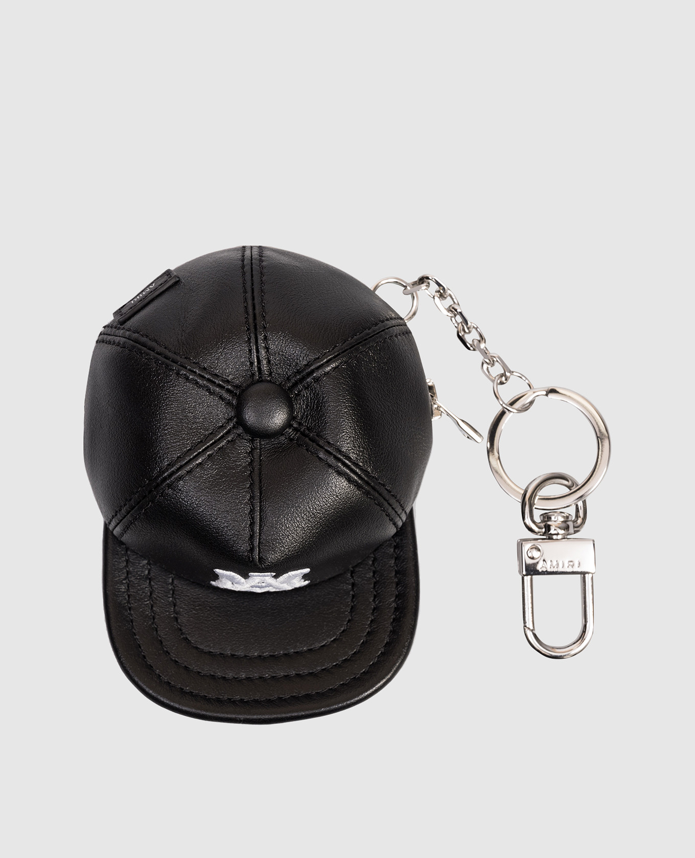 

Black leather key chain in the shape of a cap AMIRI