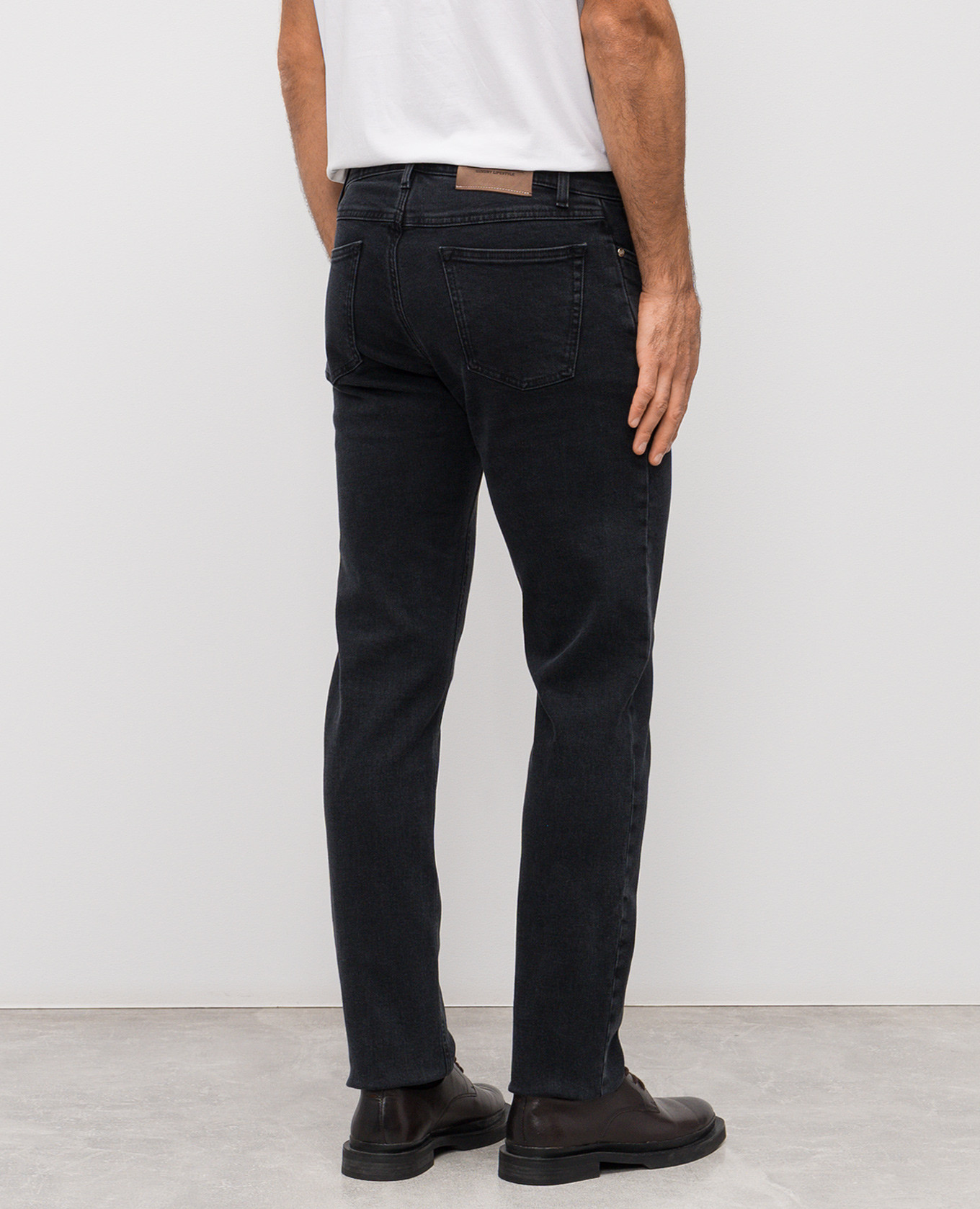 

Grey jeans with logo patch Enrico Mandelli