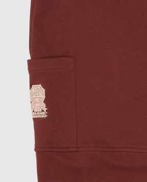 Brunello Cucinelli Children's burgundy joggers with textured emblem BN05NE473B
