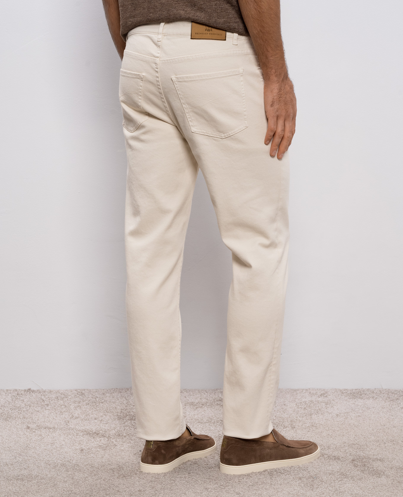 

Beige jeans with logo patch Brunello Cucinelli
