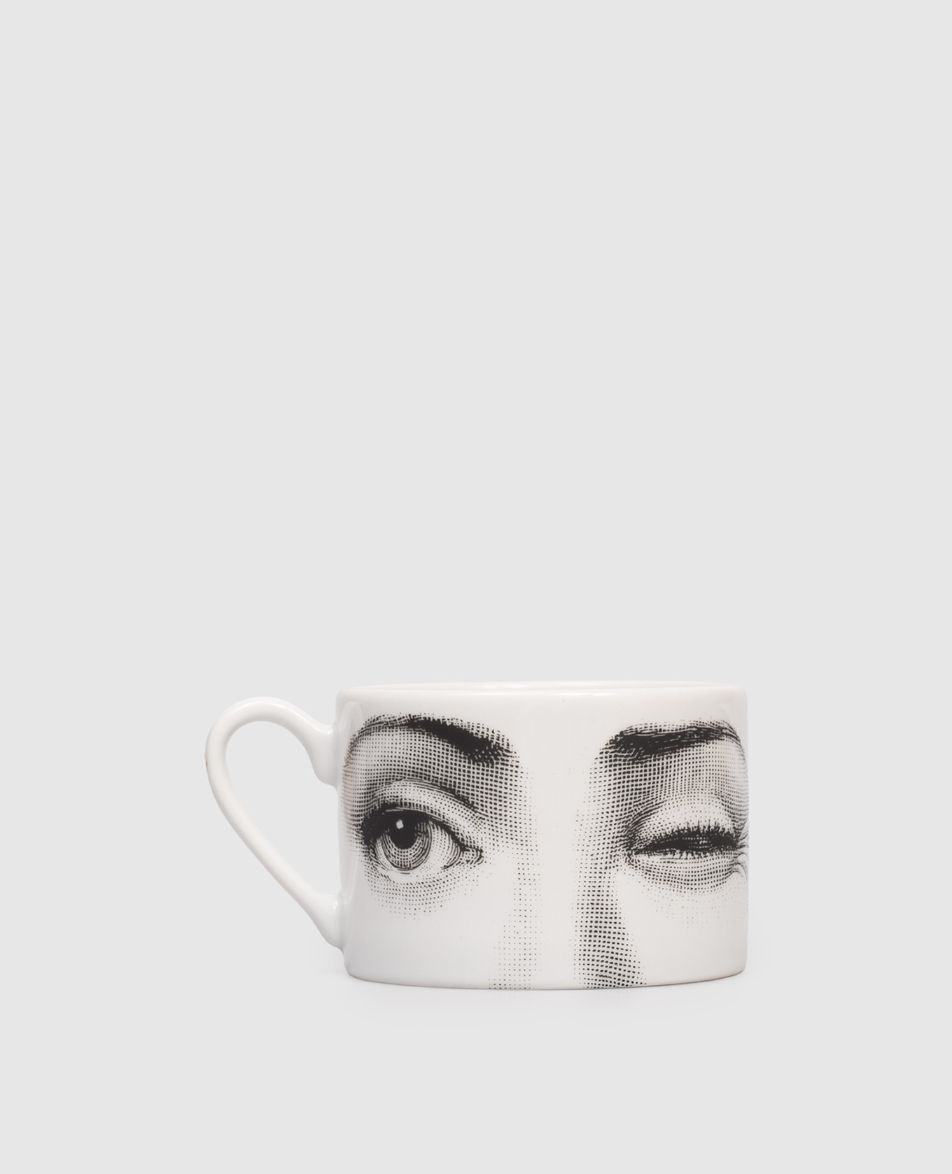 

White porcelain tea set Tema e Variazioni L'antipatico with cup and saucer Fornasetti