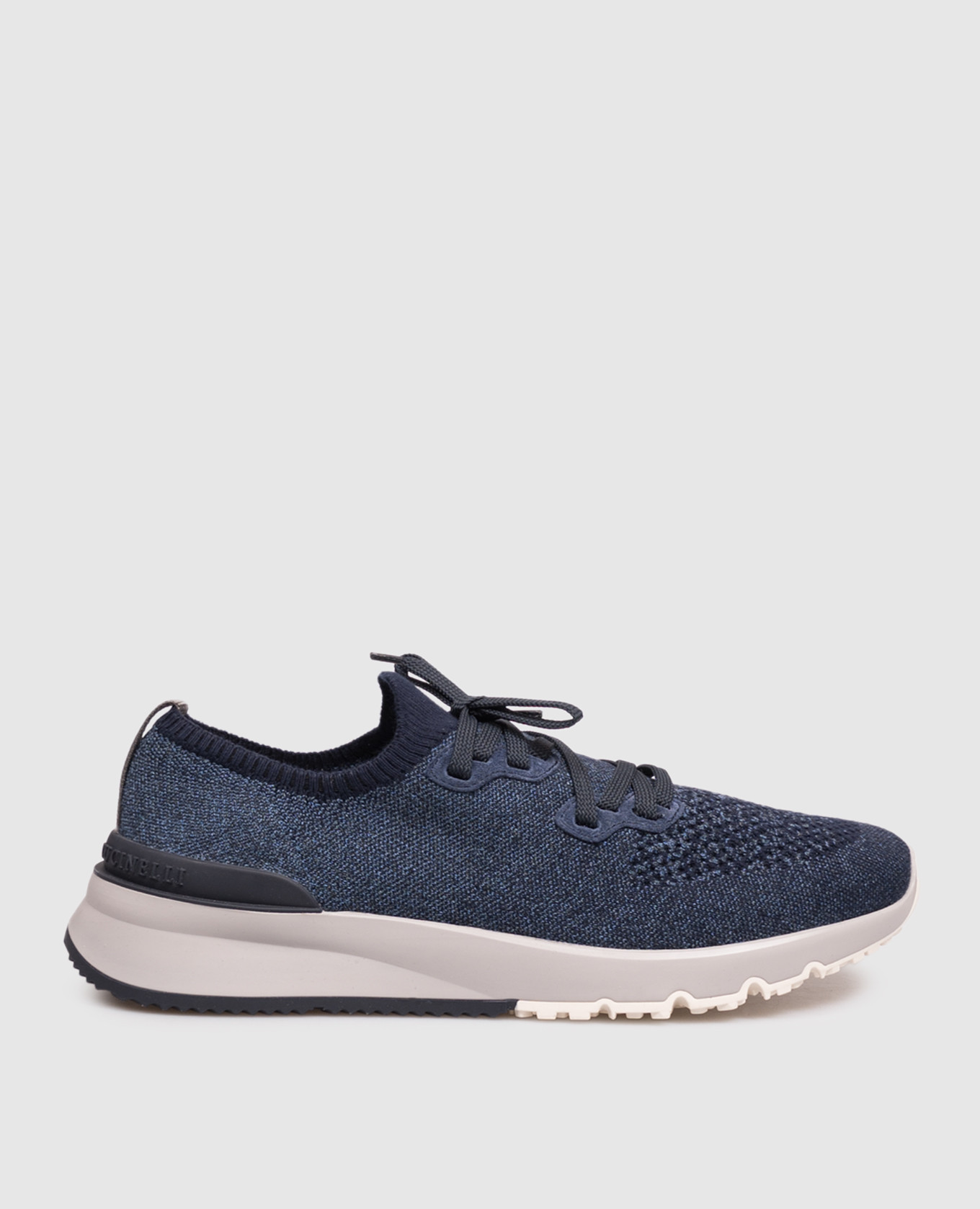 Blue sneakers with textured logo