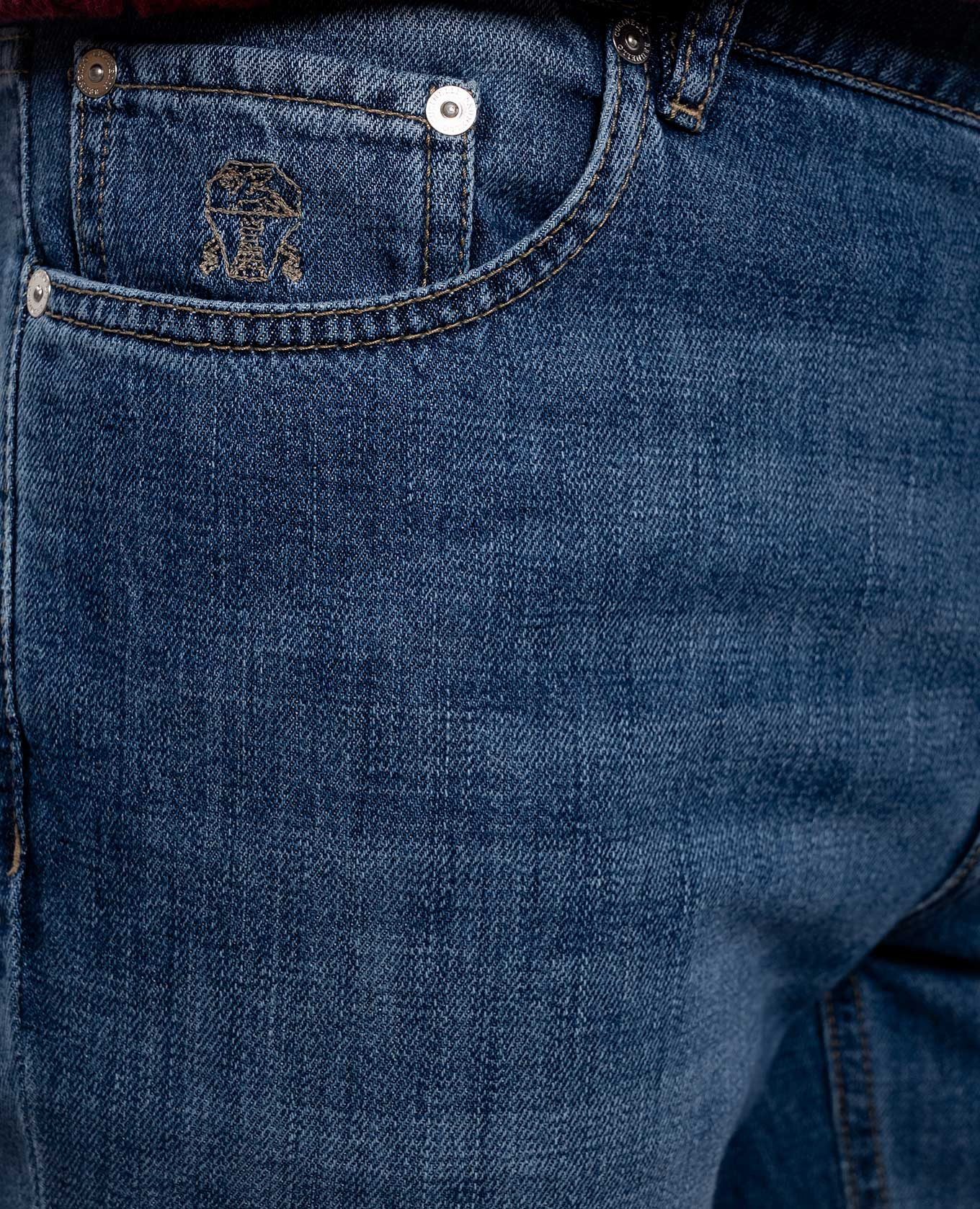 

Blue jeans with embroidered emblem Brunello Cucinelli