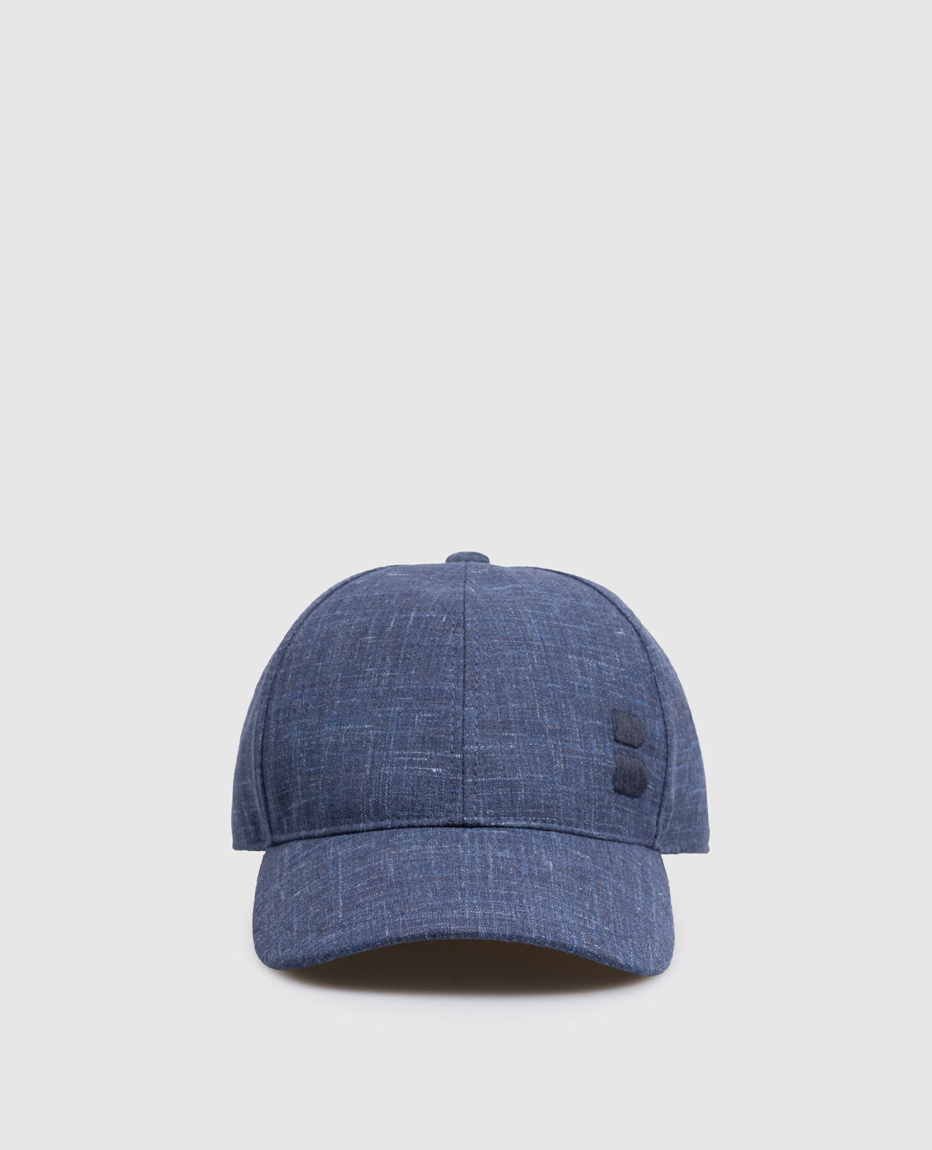 

Blue wool, silk and linen cap with emblem Brett Johnson